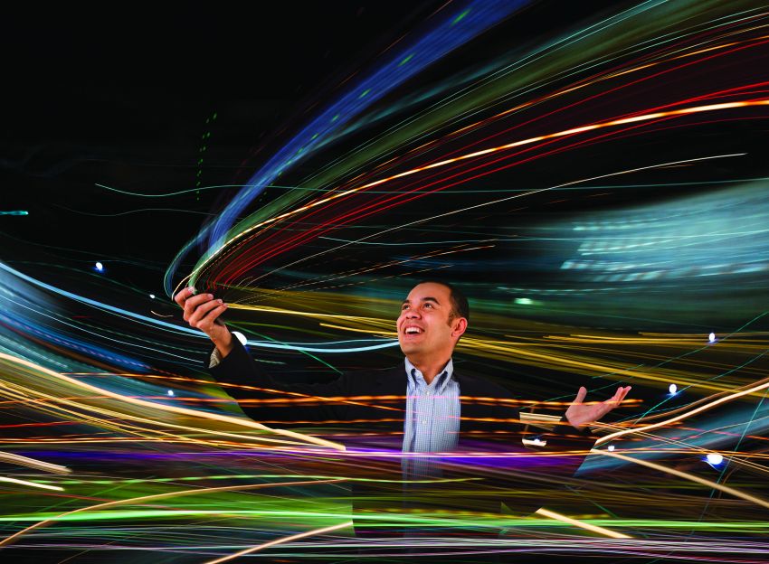 Man playing with multi-colored laser lights